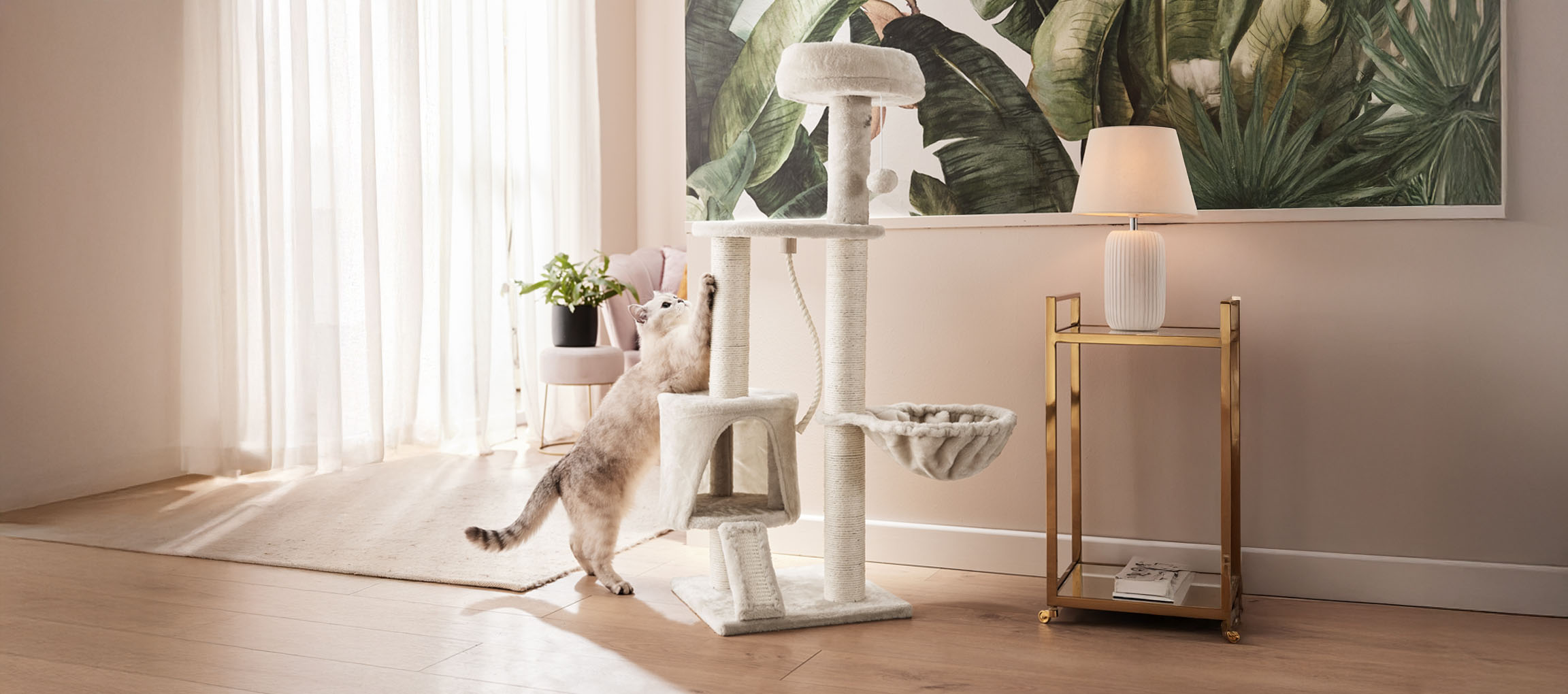 Beige cat tree with scratching post, tropical style.